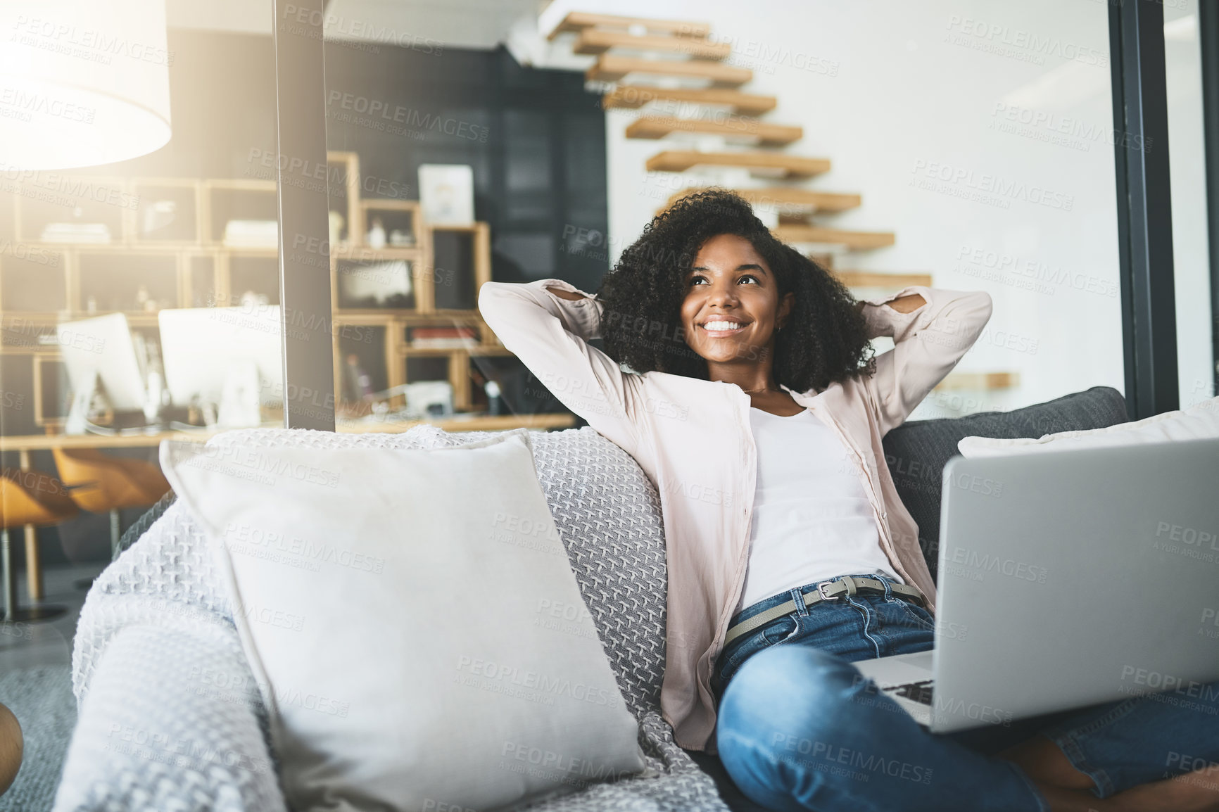 Buy stock photo Happy, thinking and black woman on laptop on sofa for website, internet and remote work. Freelancer, professional and person relax on computer for research, connection and work break in living room