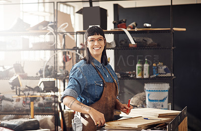 Buy stock photo Cropped portrait of an attractive young woman working in her creative workshop