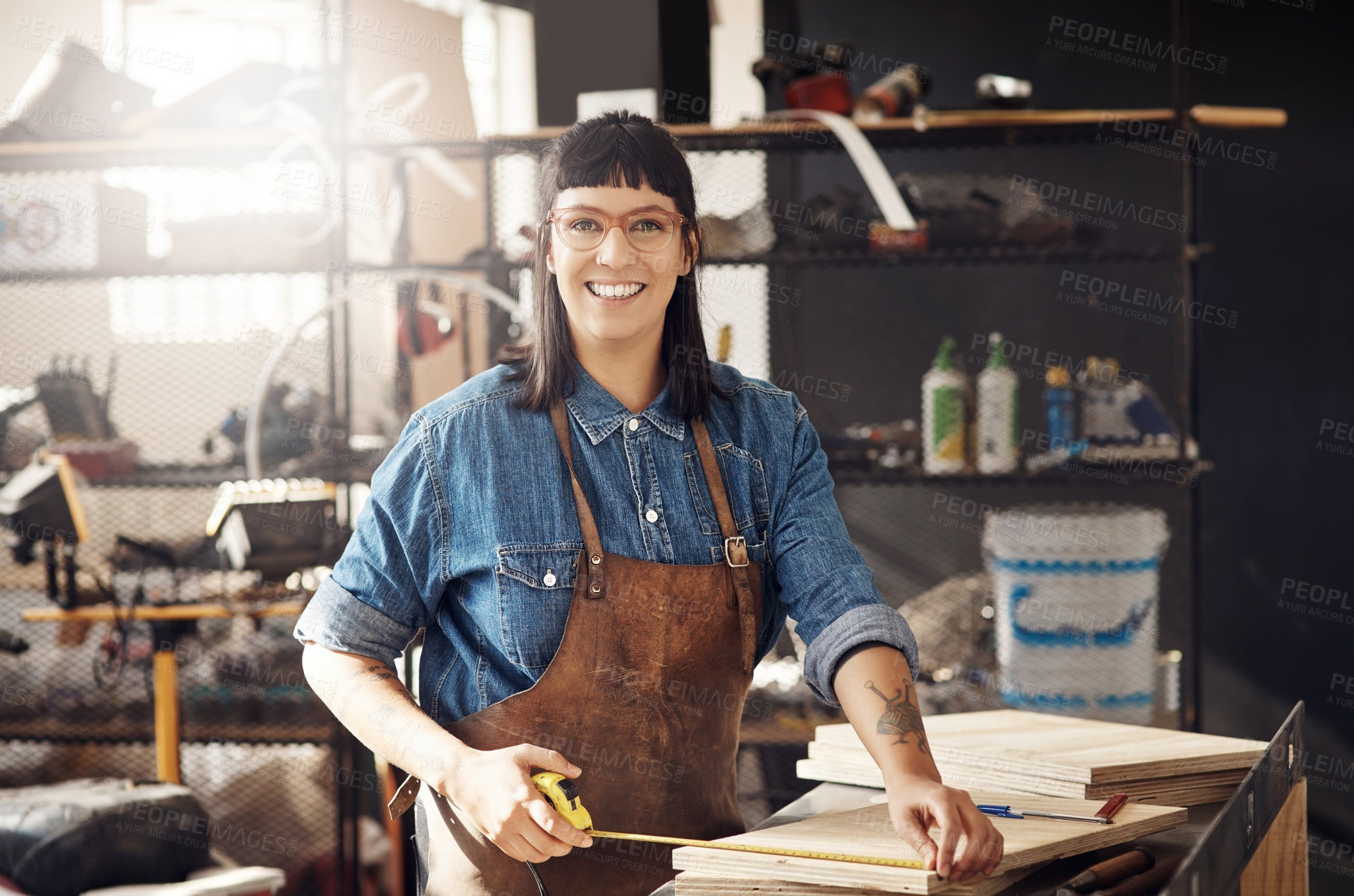 Buy stock photo Cropped portrait of an attractive young woman working in her creative workshop