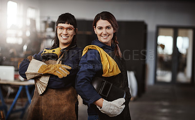 Buy stock photo Cropped portrait of two attractive young female artisans standing in their workshop