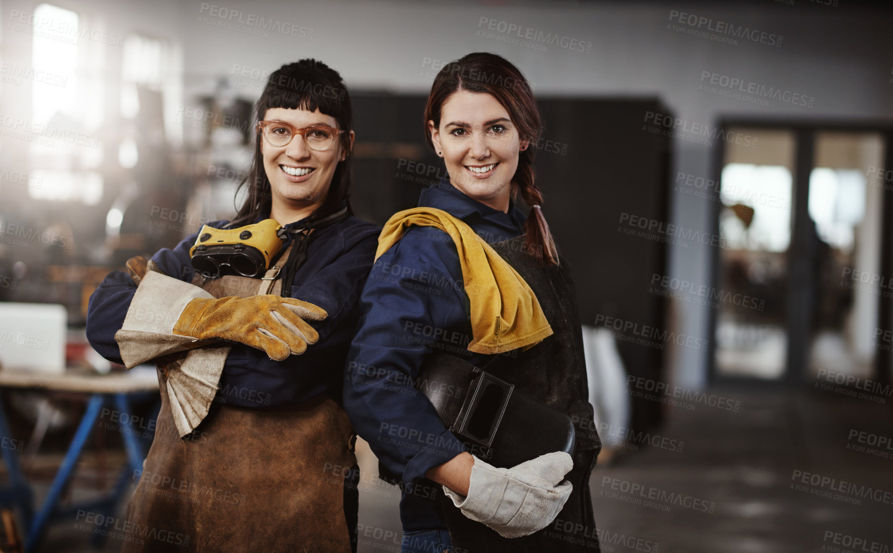 Buy stock photo Cropped portrait of two attractive young female artisans standing in their workshop