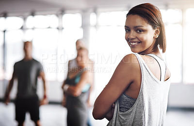 Buy stock photo Cropped shot of an attractive young woman working out at the gym