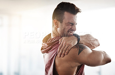 Buy stock photo Man, stretch and shoulder in gym for fitness, warm up routine and strength training for health or wellness. Male athlete, bodybuilder and ready for workout to build muscle for competition and sports.