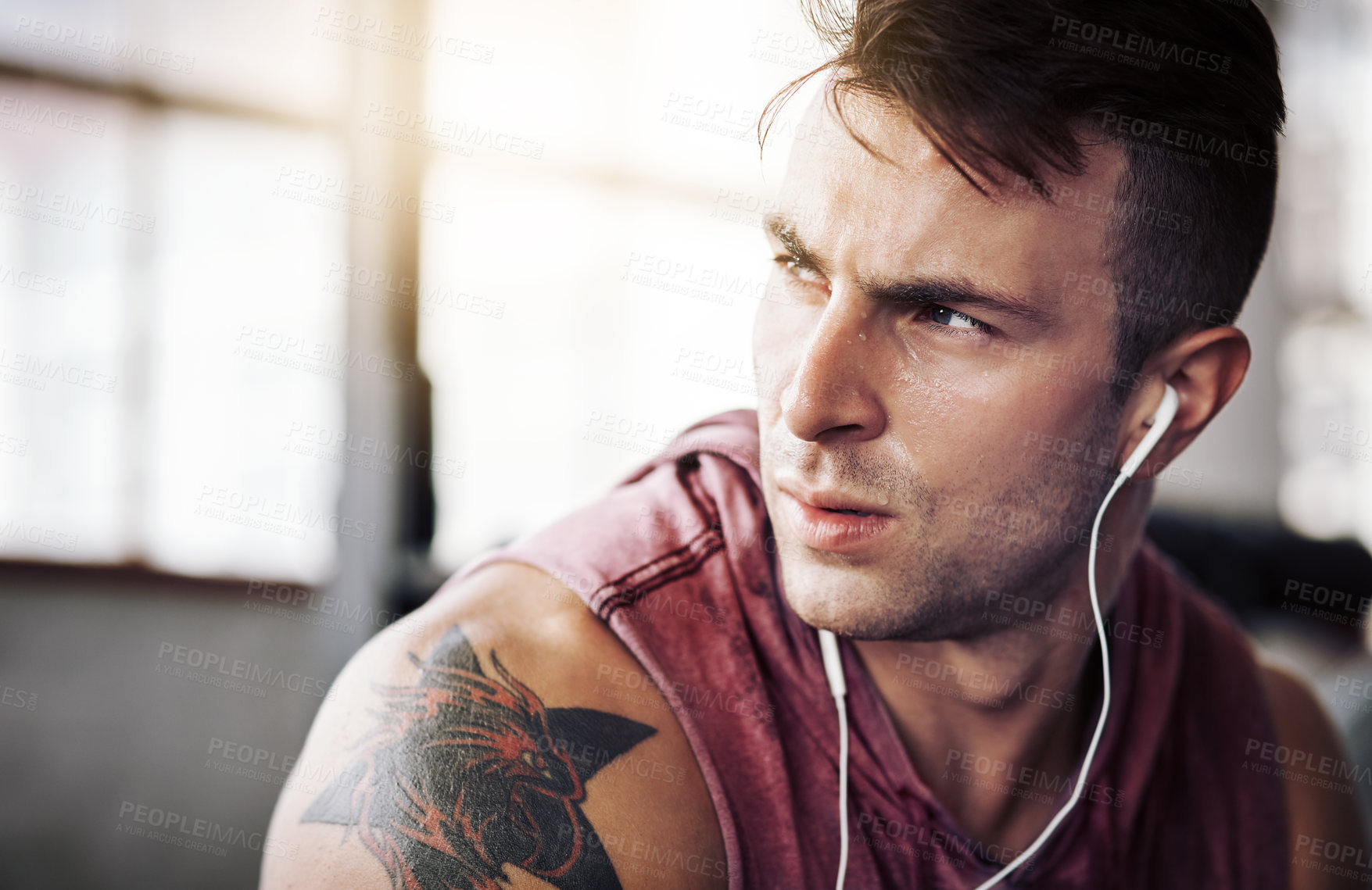 Buy stock photo Man, tired and music in gym for fitness, exercise and wellness with radio for motivation. Training, thinking and male bodybuilder on break from cardio, workout or earphones for listening to podcast