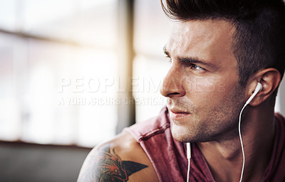 Buy stock photo Cropped shot of a handsome young man at the gym