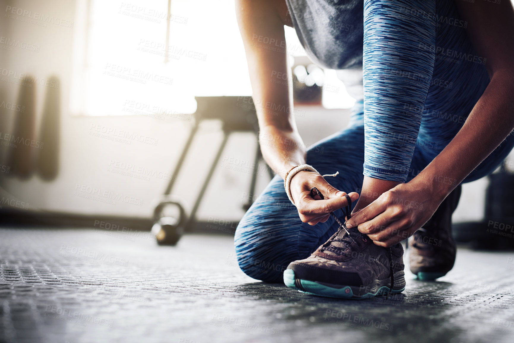 Buy stock photo Woman, tie shoelace and training in gym, getting ready and prepare for exercise or workout on floor. Female person, foot and fasten sneakers for sports routine, running shoes and athlete for cardio