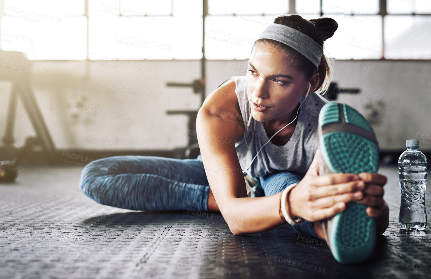 Buy stock photo Fitness, legs and thinking with woman stretching on floor of gym for health or wellness. Exercise, vision and warm up for workout with athlete getting ready for improvement or training routine