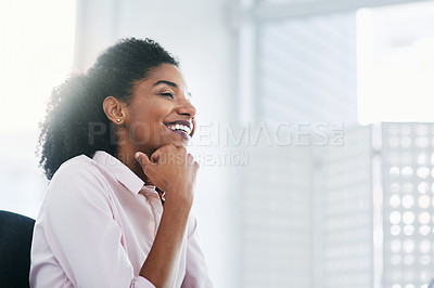 Buy stock photo Shot of a young businesswoman working in an office