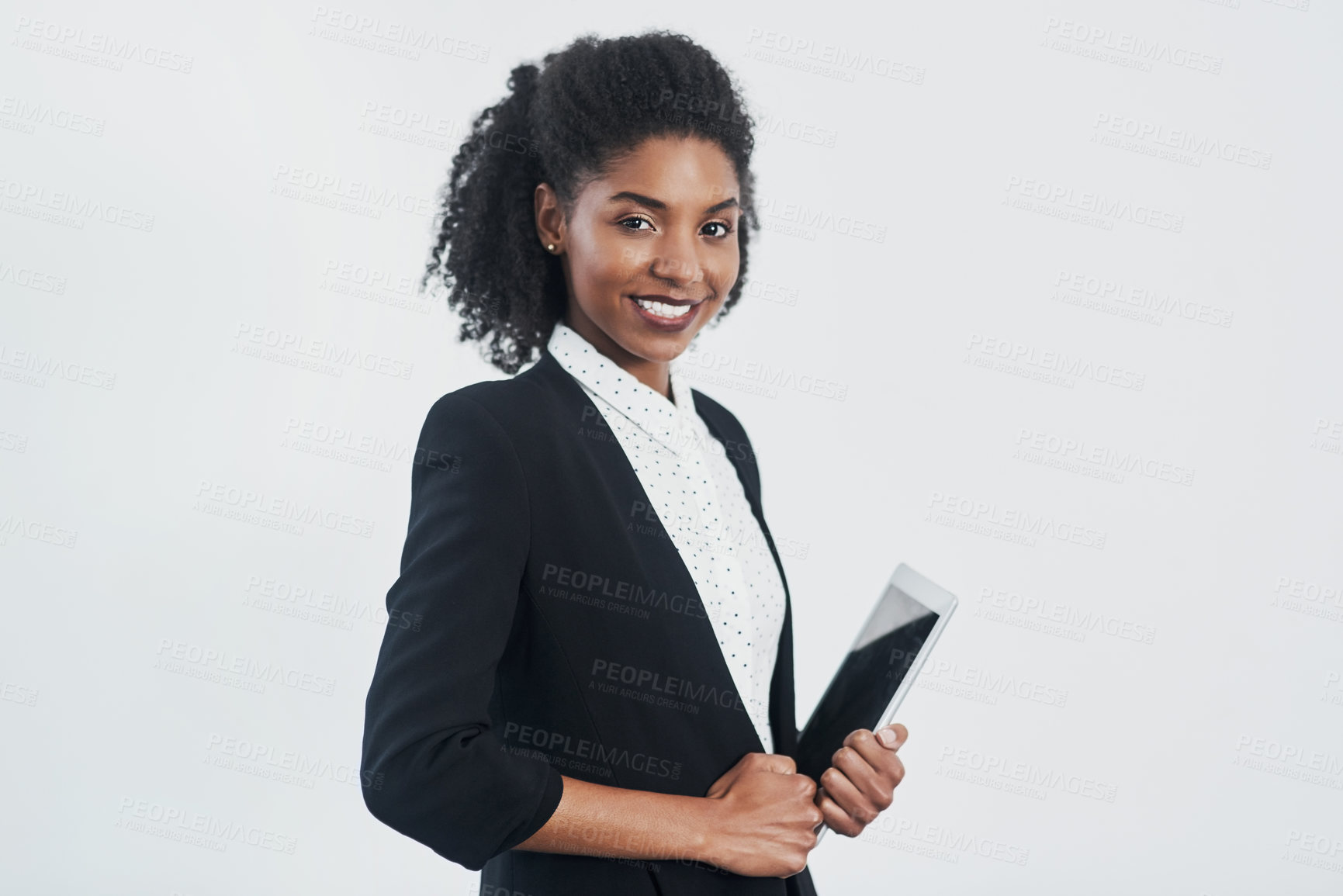 Buy stock photo Studio shot of a confident young businesswoman against a gray background