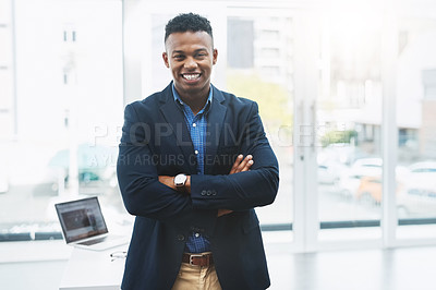 Buy stock photo Portrait of a young businessman standing in an office