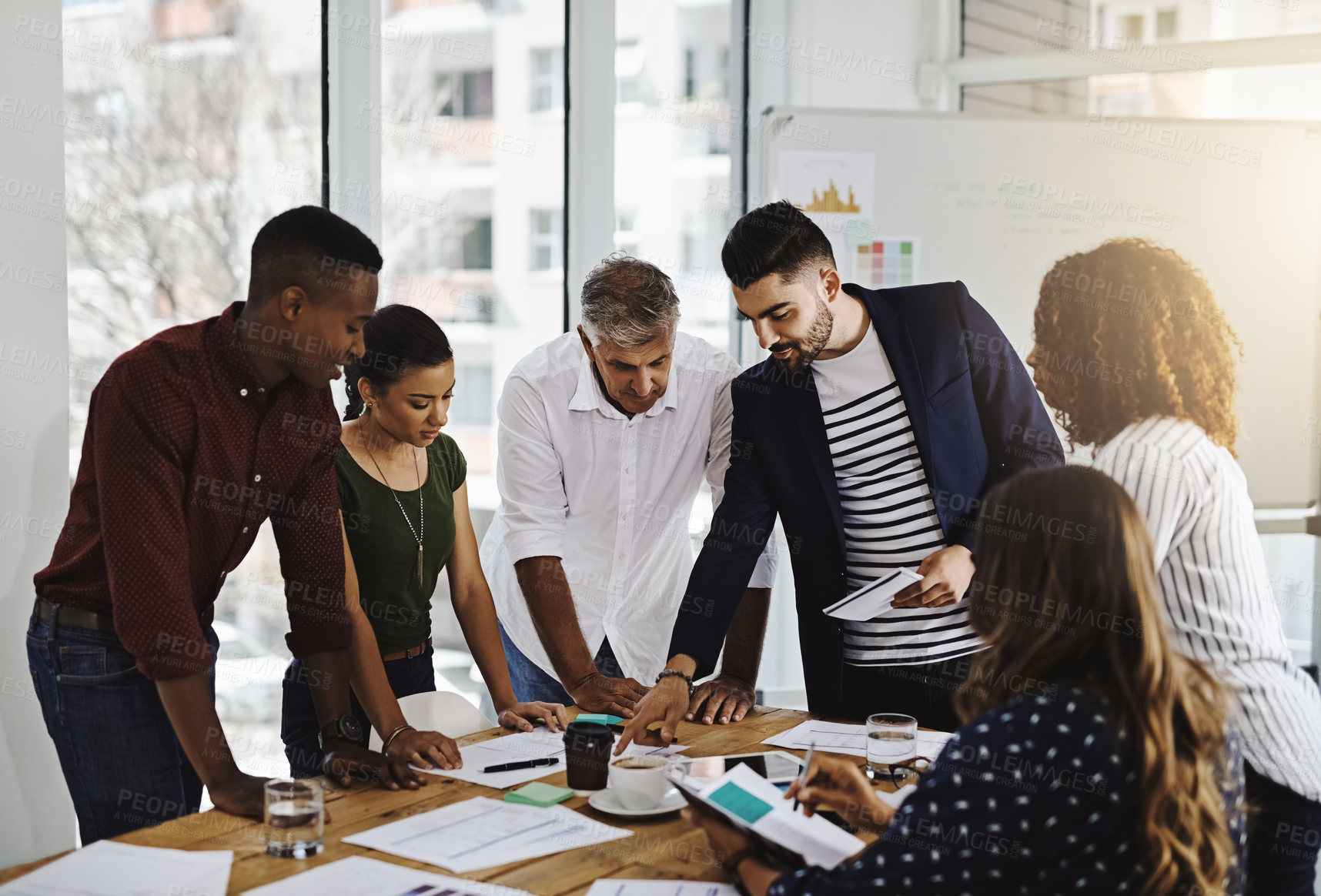 Buy stock photo Cropped shot of a group of creative employees working in a modern office