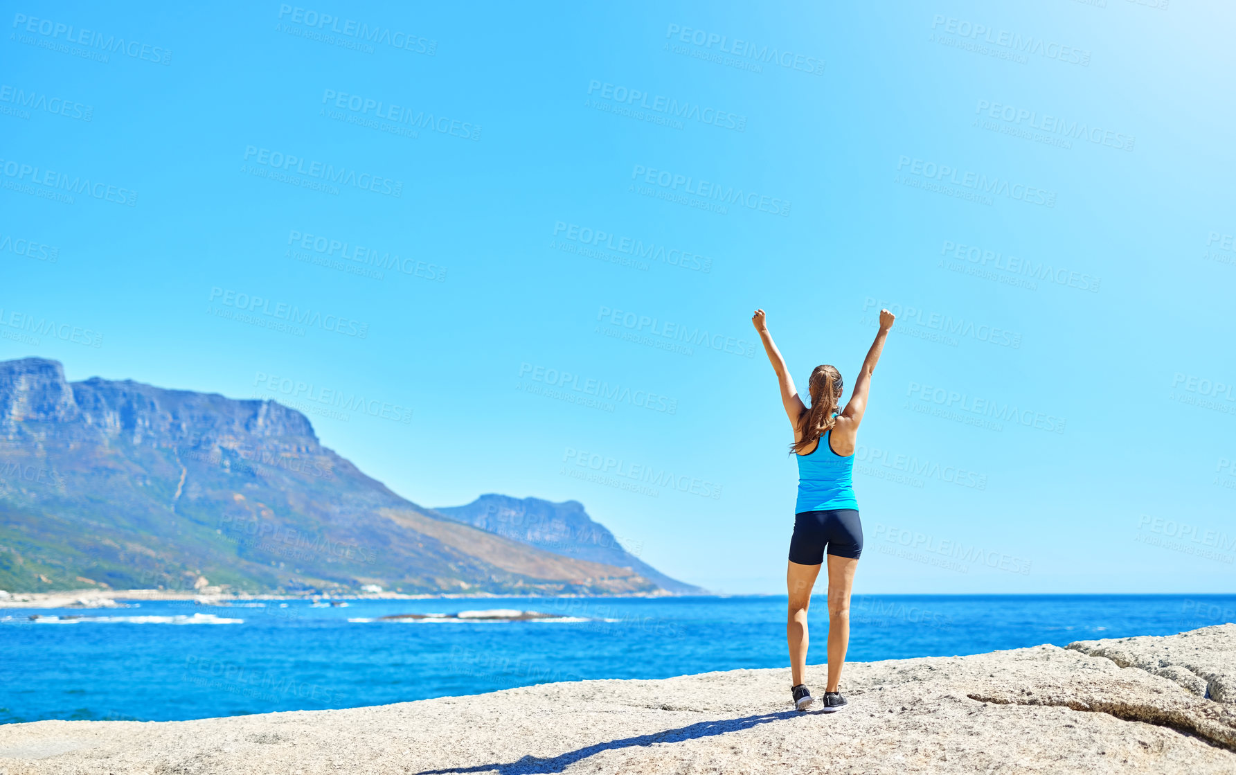 Buy stock photo Fitness, freedom and girl on beach with achievement, space and outdoor training exercise. Ocean, celebration and woman runner with arms up, blue sky and morning workout goals in nature from back.