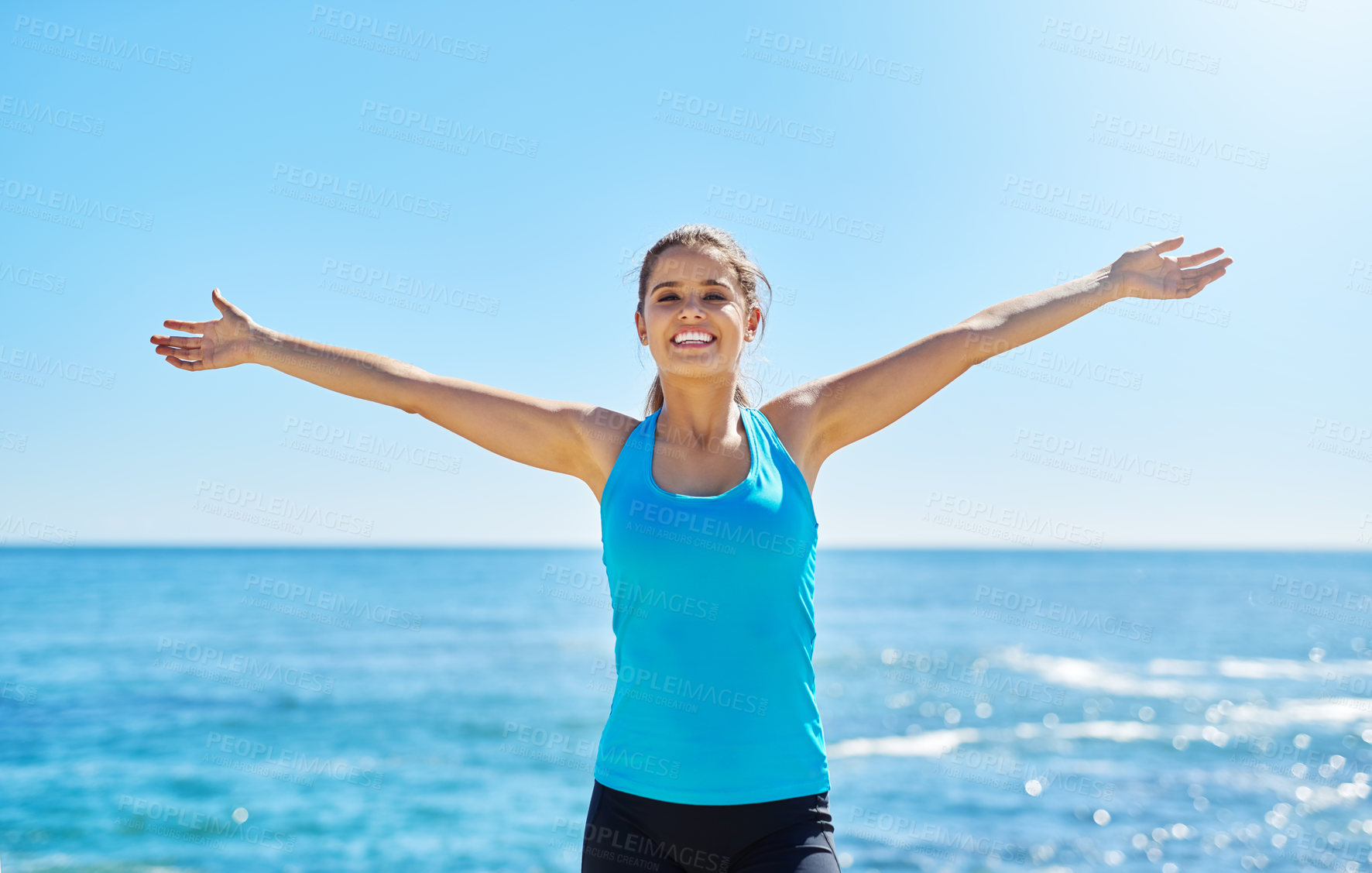 Buy stock photo Portrait, smile and woman at ocean for freedom, summer workout or sports exercise with blue sky. Beach, happy and female athlete at sea for wellness, fitness and training routine in Miami nature