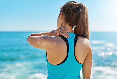 Buy stock photo Cropped shot of a sporty young woman suffering from a sports injury