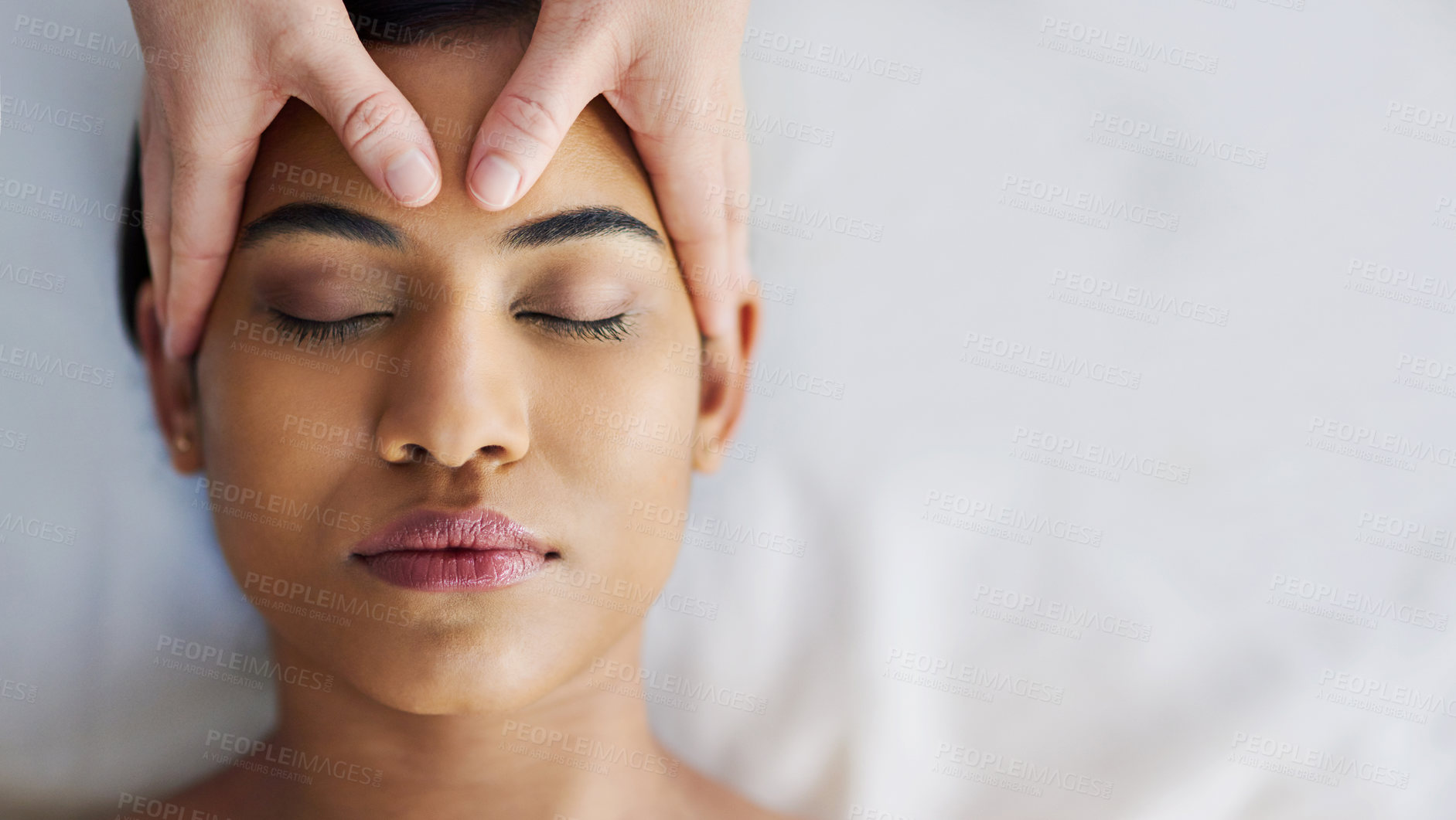 Buy stock photo Shot of an attractive young woman getting a massage at a spa