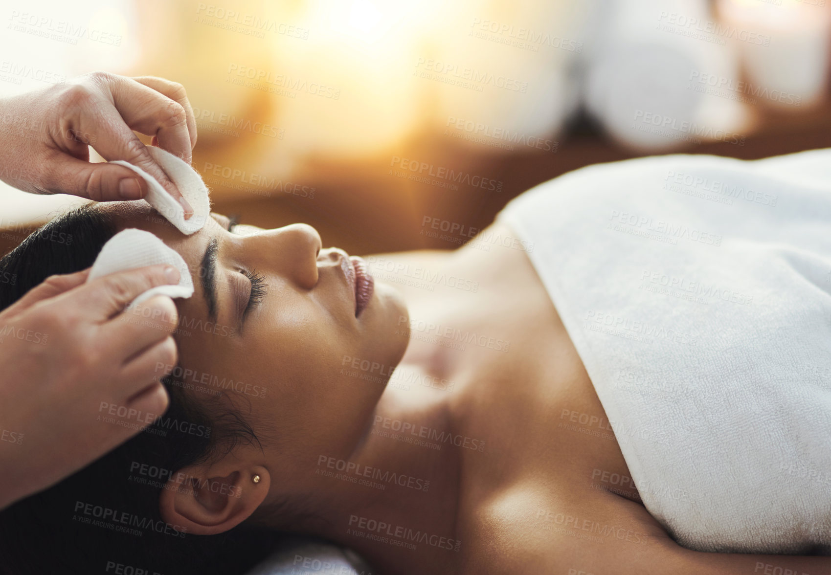 Buy stock photo Shot of an attractive young woman getting a massage at a spa