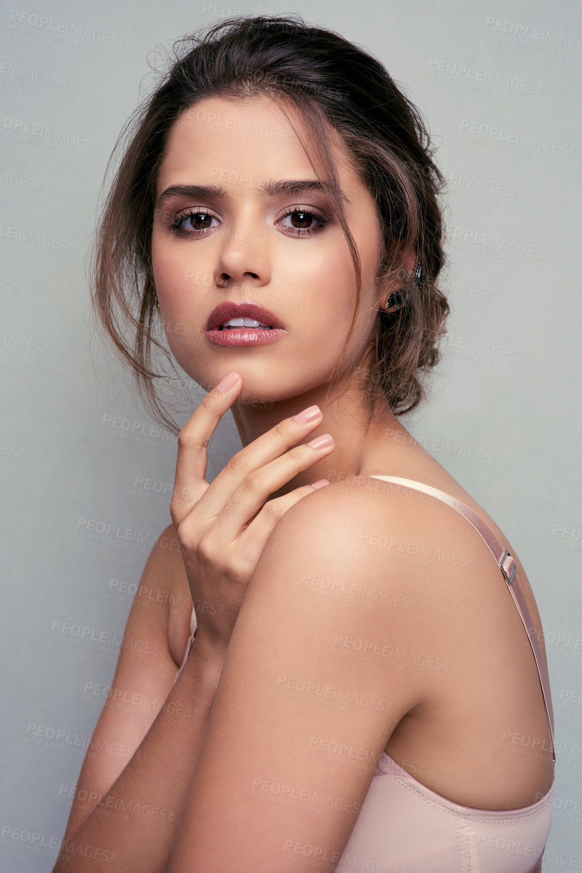 Buy stock photo Beauty, cosmetics and portrait of woman posing with clear, smooth and glowing skin on a grey studio background. Makeup, cosmetic and beautiful female with soft, perfect facial treatment 