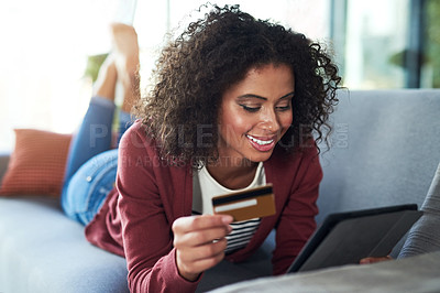 Buy stock photo Woman, home and happy on tablet with credit card on sofa for online shopping and payment. Female person, couch and smile in living room on website for internet banking with detail verification