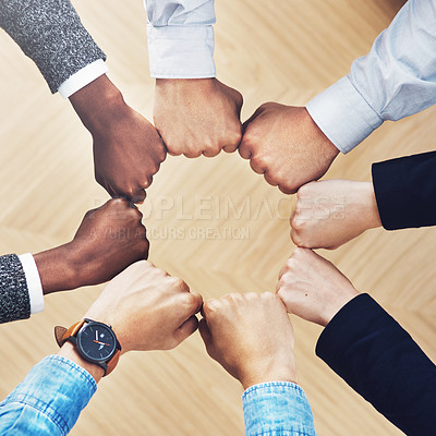 Buy stock photo Team building, fist bump or hands of business people for diversity, group support or community in office. Teamwork, above or circle of fists for motivation, collaboration or partnership for a mission