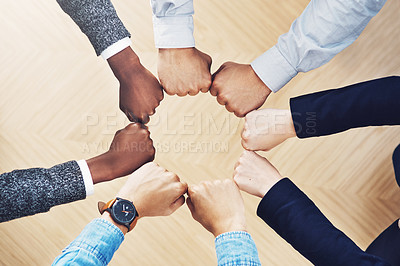 Buy stock photo Teamwork, fist bump or hands of business people together for motivation, group support or community. Collaboration, team building or above of circle fists for diversity, trust or office partnership