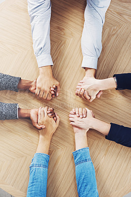 Buy stock photo Above, solidarity or business people holding hands for support, team building or teamwork in office. Partnership, zoom or employees in group collaboration with diversity or mission for goals together