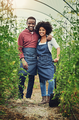 Buy stock photo Full length portrait of a young farm couple standing in one of their vineyards