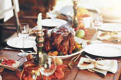 Buy stock photo Thanksgiving, turkey and food with a roast meal on a dinner table for a celebration event or tradition. Christmas, chicken and lunch with a healthy diet on a wooden surface for the festive season
