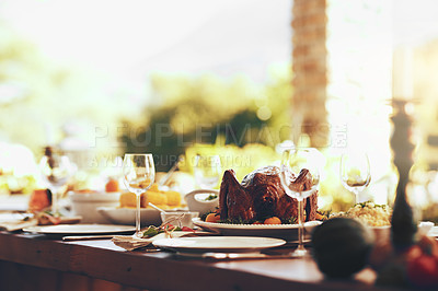 Buy stock photo Food, table and traditional celebration on a patio with no people for thanksgiving, party and a fun gathering setup for family at home. Turkey, chicken and dining table ready for family lunch outdoor