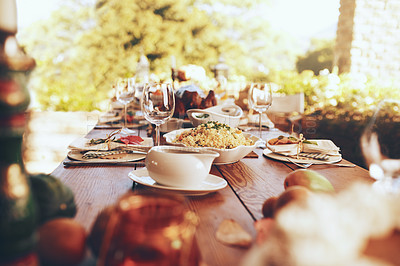 Buy stock photo Food, celebration and dinner party in a garden for fine dining, nutrition and table setting. Lunch, celebration and tradition on a patio with a prepared dinner on a table in the backyard of a house