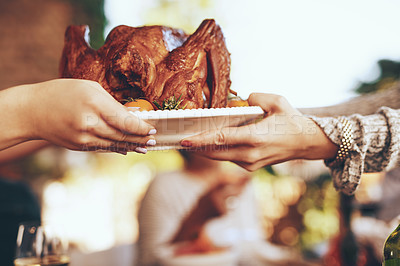 Buy stock photo Chicken, lunch and hands at a party, celebration or Christmas event for eating together. Food, nutrition and people giving a turkey on a plate for dinner, feast and fine dining in nature with bokeh