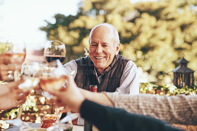 Buy stock photo Wine, cheers and grandpa in christmas toast with family for holiday celebration together with food and friends in garden. Hands, wine glasses and friendship, senior man with smile at dinner party
