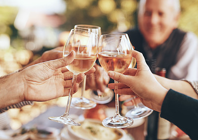 Buy stock photo Hands, glass and cheers with a group of people drinking alcohol together outdoor in celebration of the festive season. Party, wine and drink with a man and woman family doing cheers to tradition