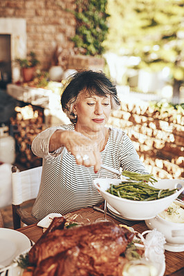 Buy stock photo Dinner, dish and senior woman with food at an outdoor dinner, party or event in the garden. Eating, lunch and elderly lady serving vegetables with roast meat at a outside dining table at her home. 