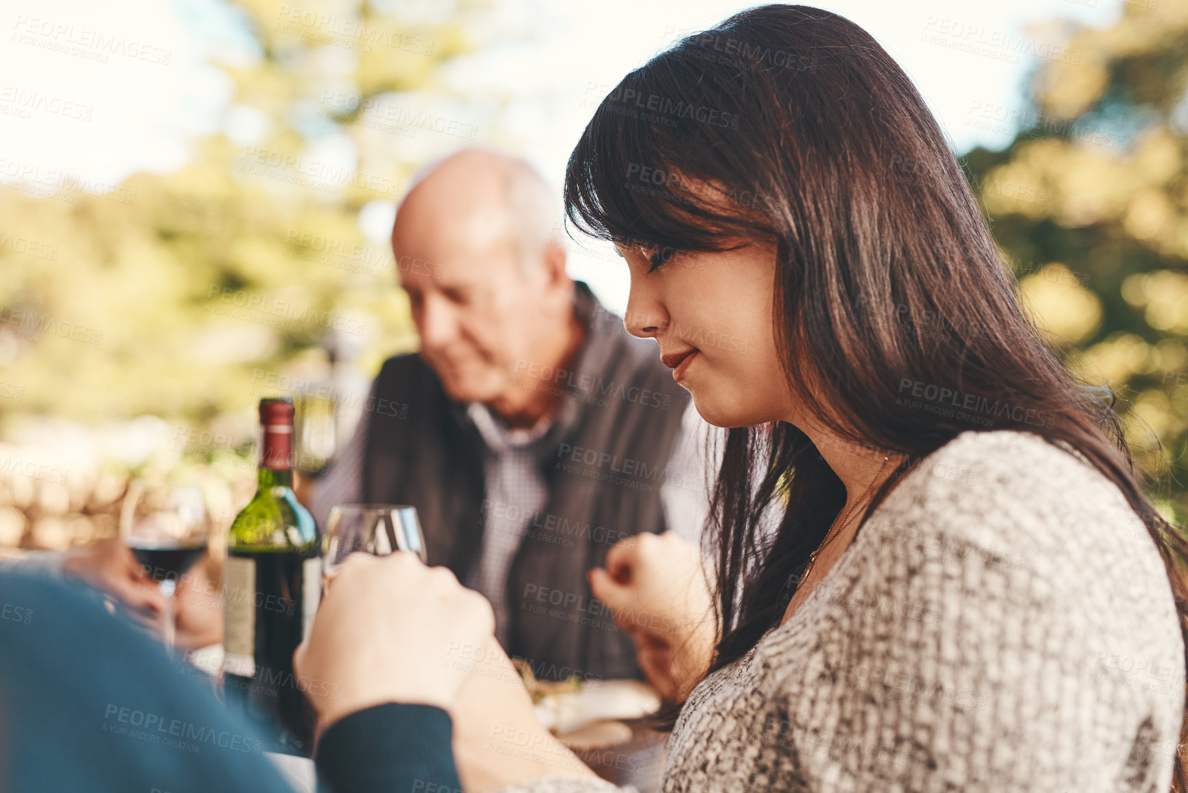 Buy stock photo People, prayer before eating food for bonding, content for lunch and outdoor. Religious gesture, group and holding hands for brunch, family gathering or quality time  for break, calm or peaceful