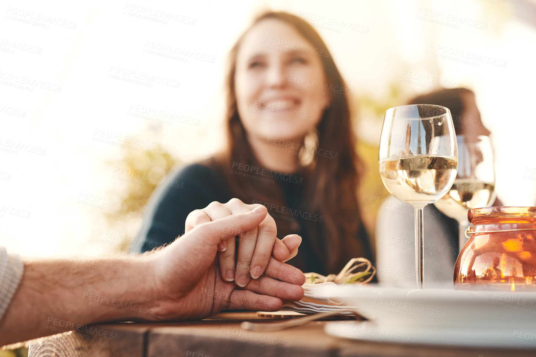 Buy stock photo Holding hands, love and couple at a dinner celebration with support, care and trust on Christmas. Gratitude, kindness and man and woman with affection at a Thanksgiving lunch, party or gathering