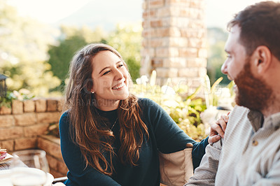 Buy stock photo Happy couple, talking and outdoor on patio for a funny conversation while eating breakfast or lunch in summer. Woman and man together for happiness, love and care while laughing to relax on vacation