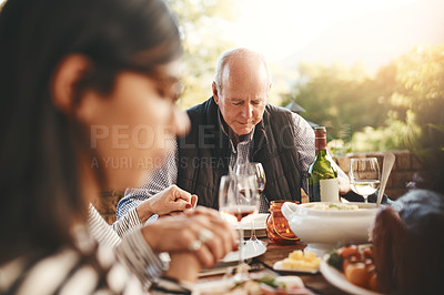 Buy stock photo Family party, celebration and praying before a lunch, Christmas and gathering with food in a backyard. Holding hands, gratitude and friends with a prayer for Thanksgiving dinner on a patio garden