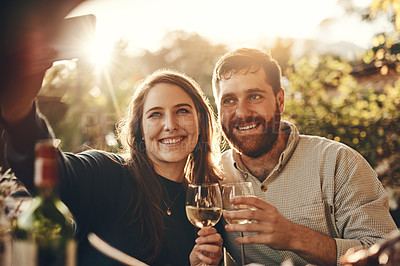 Buy stock photo Phone selfie, wine toast and couple on romantic love date for marriage anniversary, outdoor freedom or peace. Picture flare, fine dining and wine tasting man and woman bonding at vineyard restaurant
