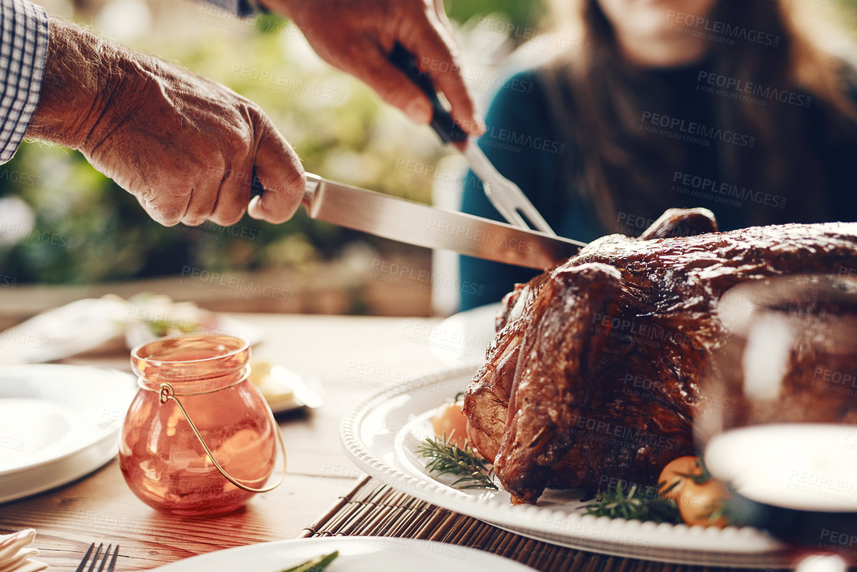 Buy stock photo Turkey, thanksgiving and chicken cut by hands at a table for a family at a home or house gathering celebration. Party, zoom and man with knife cutting food or meat to celebrate and eat with friends