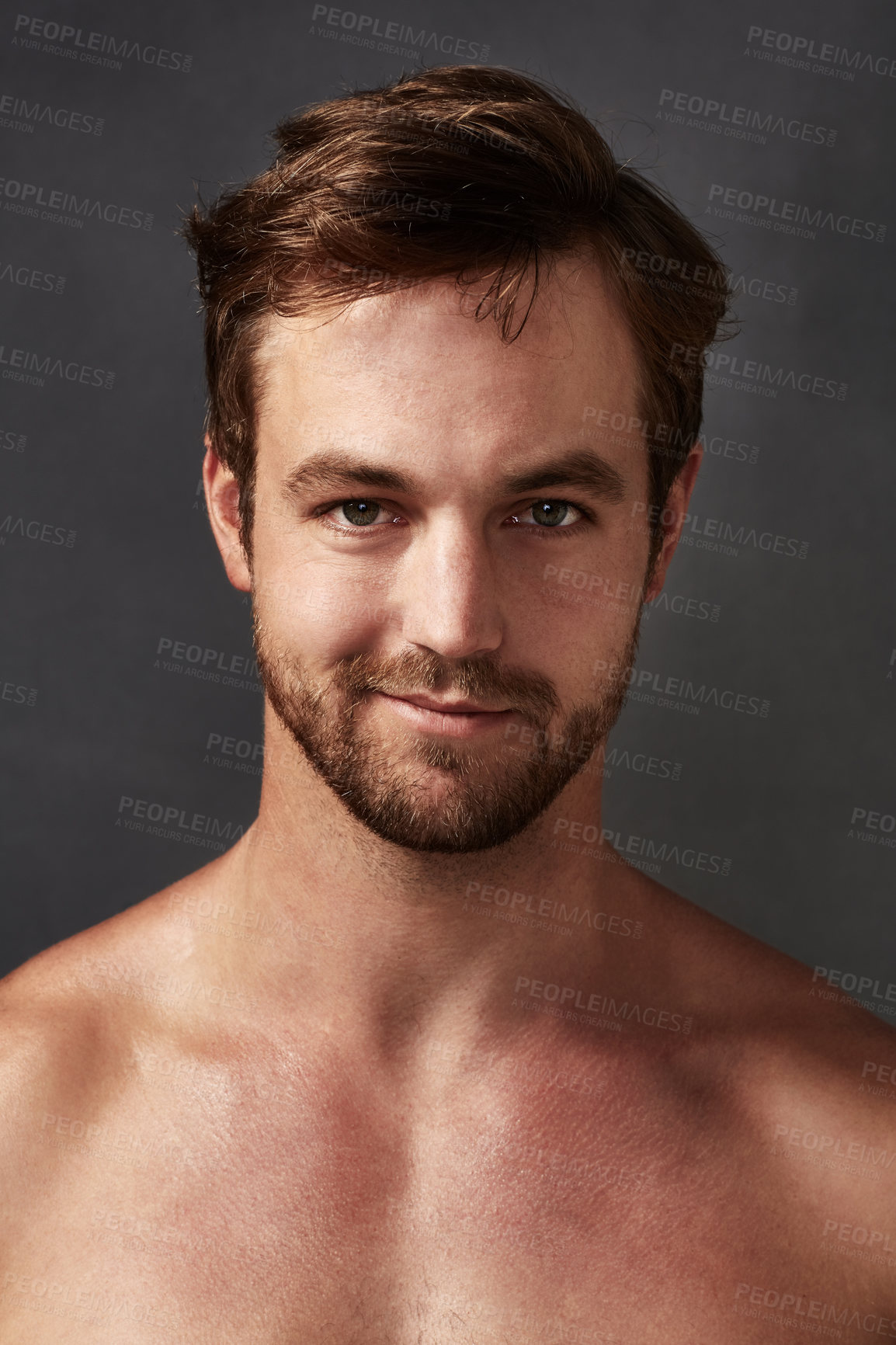 Buy stock photo Cropped portrait of a handsome young man against a grey background