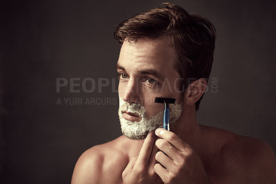 Buy stock photo Man, razor and cream for shaving in studio, clean and skincare for grooming on black background. Male person, shaver and soap for hair removal or mockup space, dermatology and facial treatment tool