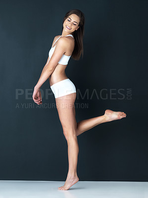Buy stock photo Happy woman, body and relax in underwear for diet, fitness or weight loss against a studio background. Attractive or gorgeous female person or model smile in slim, lean figure or health and wellness