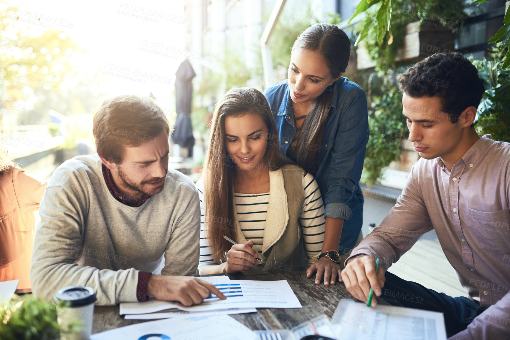 Buy stock photo Group, outdoor and business meeting with documents, cafe and reading of employees, plants and planning. Stats, colleagues and discussion of graph, paperwork and teamwork of SEO specialist and people