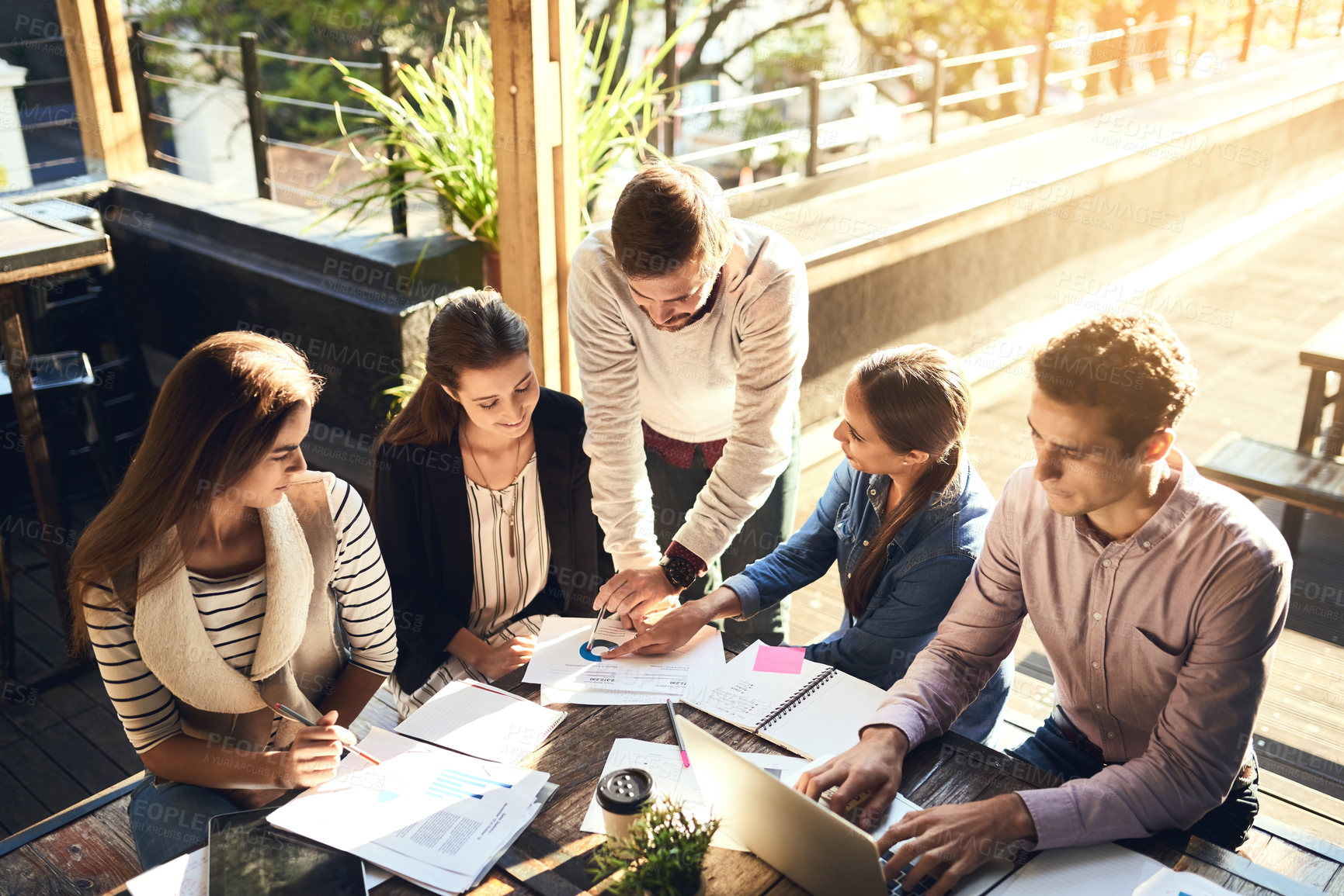 Buy stock photo Business, group and typing in meeting, cafe and ideas for project, graph and laptop on table. Planning, SEO and teamwork of people with stats, creative and discussion of information and paperwork