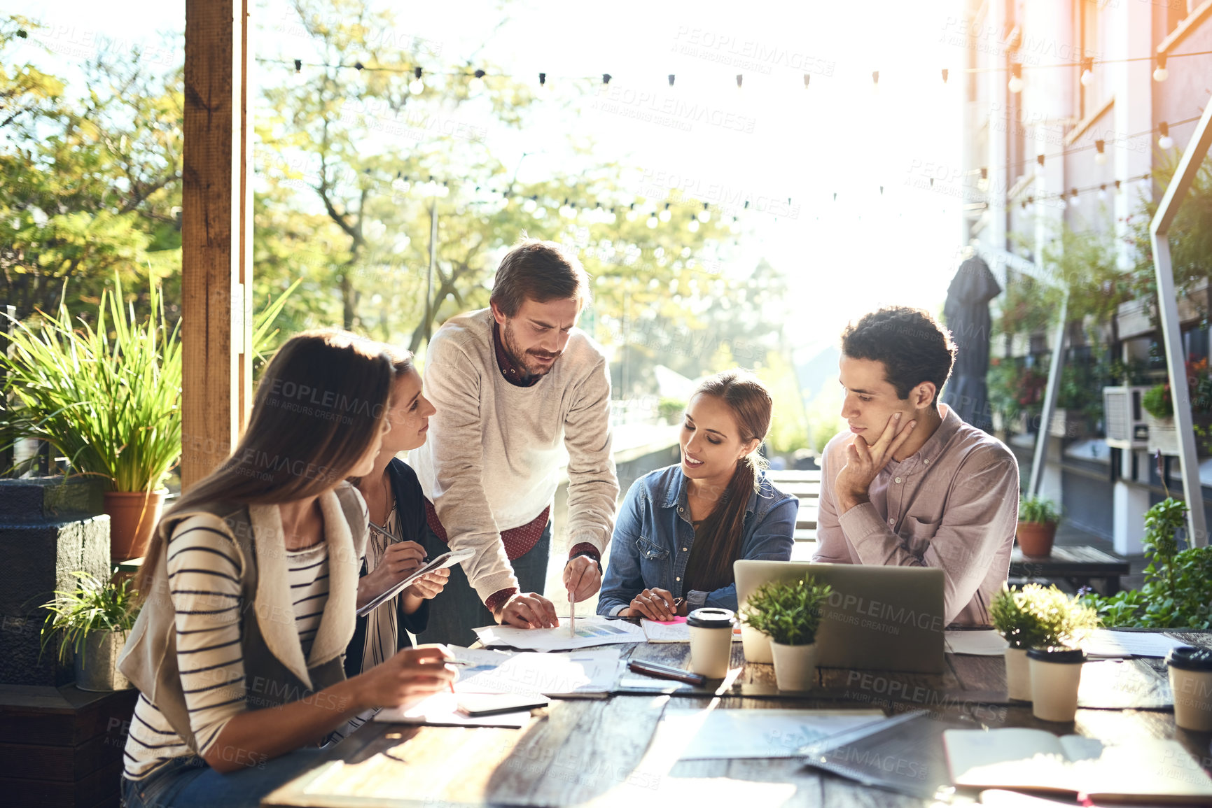 Buy stock photo Small business, people and paper at cafe for meeting, company finance and strategy for growth. Startup, team or discussion in coffee shop for collaboration, planning and man with feedback at laptop