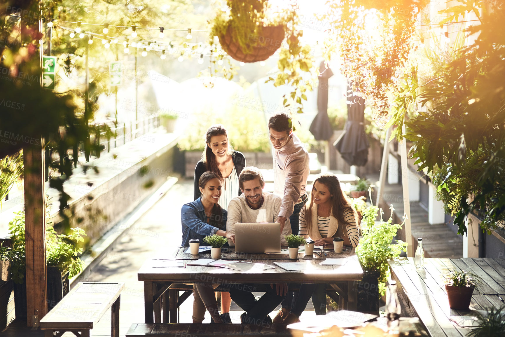 Buy stock photo Internet, ideas and business people in meeting, laptop and cooperation with creative agency, project or collaboration. Group, employees or coworkers with pc, lens flare or partnership with technology