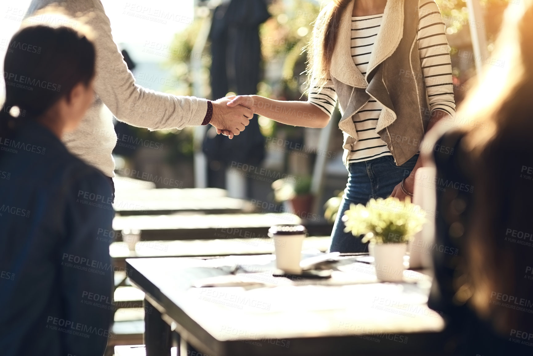 Buy stock photo Business people, hands and handshake for greeting at cafe for welcome, b2b networking or remote work outdoor. Group, employees and meeting for onboarding, partnership deal and thank you for agreement