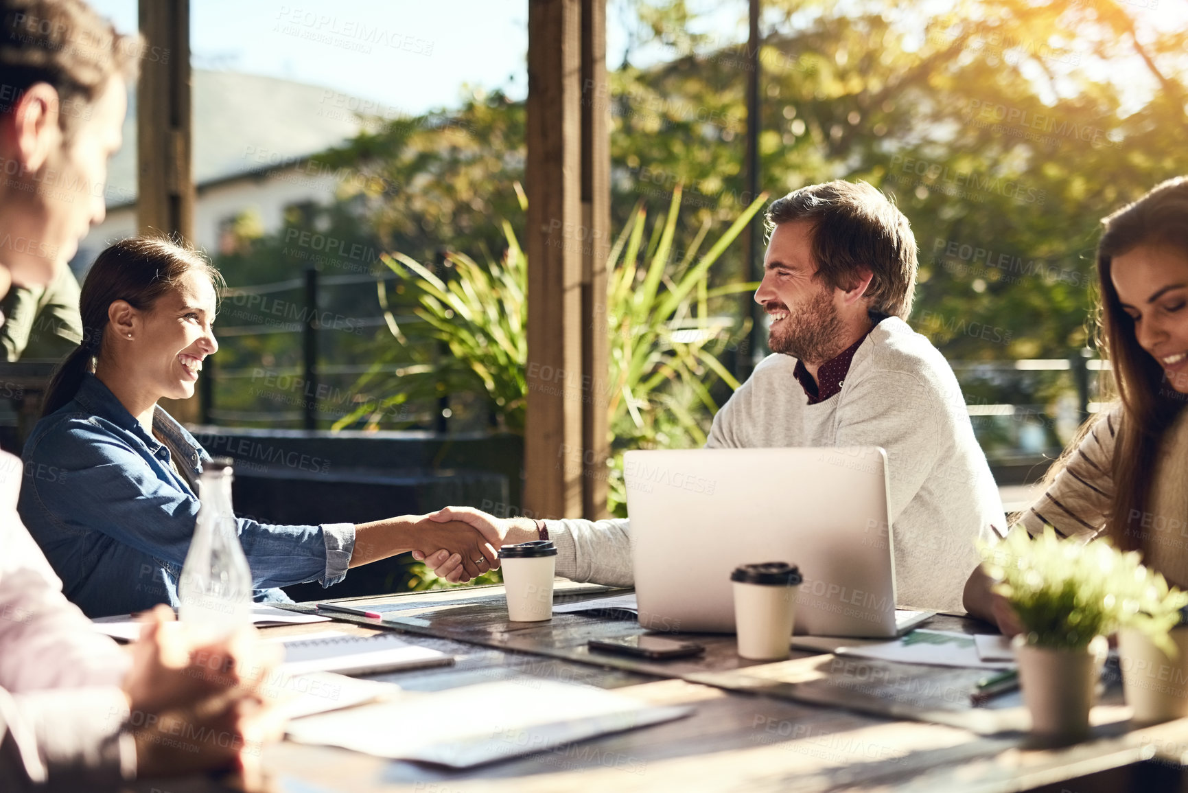 Buy stock photo Business people, meeting and handshake at cafe for introduction, onboarding and remote work opportunity. B2b worker or clients shaking hands at coffee shop of group project deal, interview or success