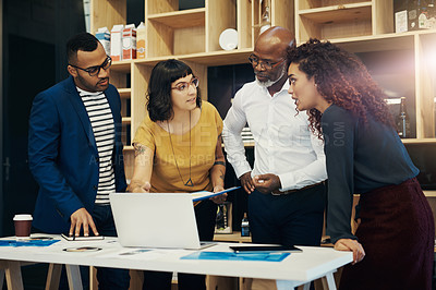 Buy stock photo Shot of a group of designers having a discussion in a modern office