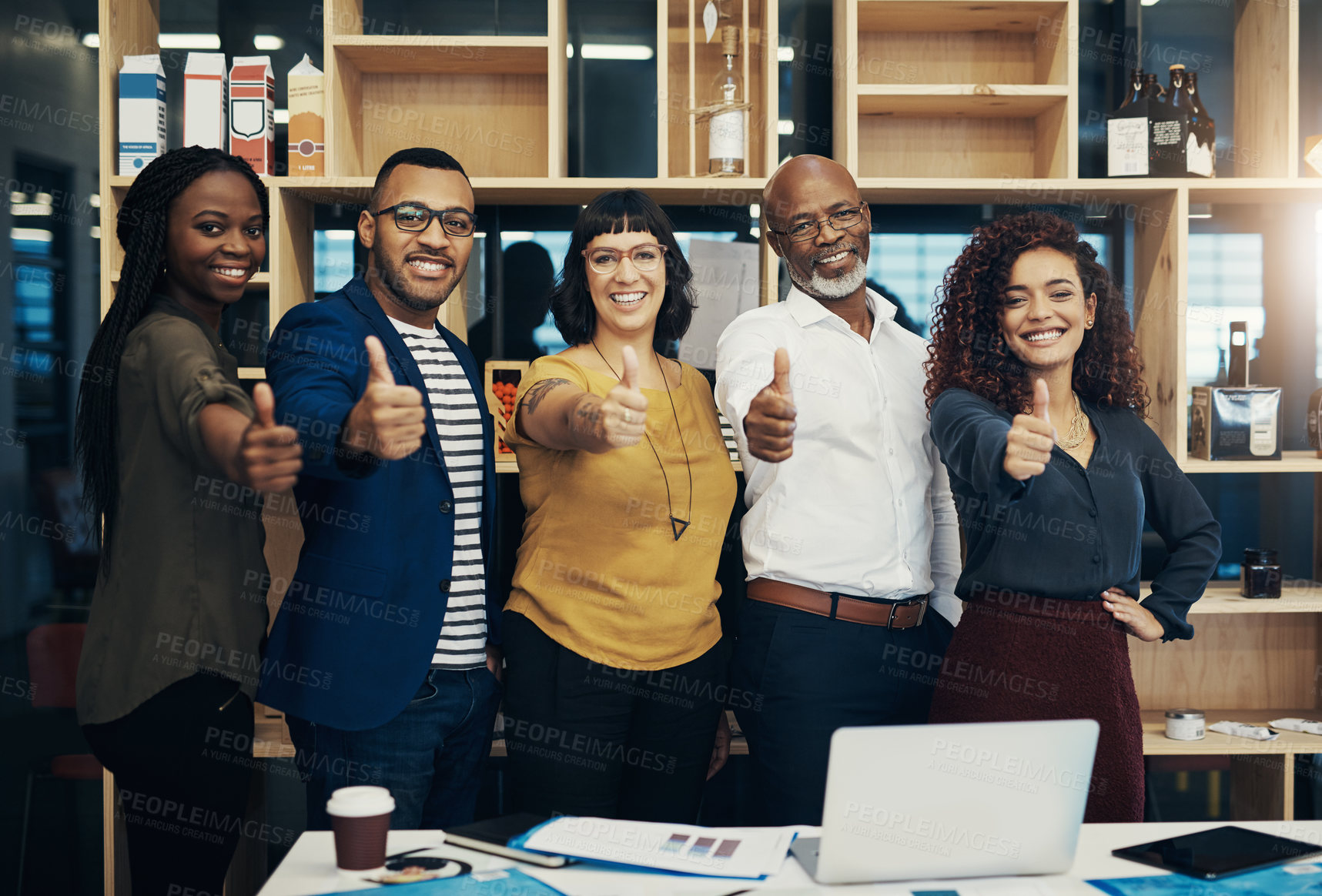 Buy stock photo Portrait of a group of creative businesspeople showing thumbs up